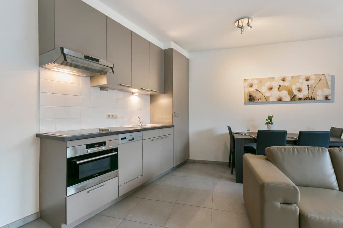 fully equipped kitchen with microwave in serviced apartment brussels canal