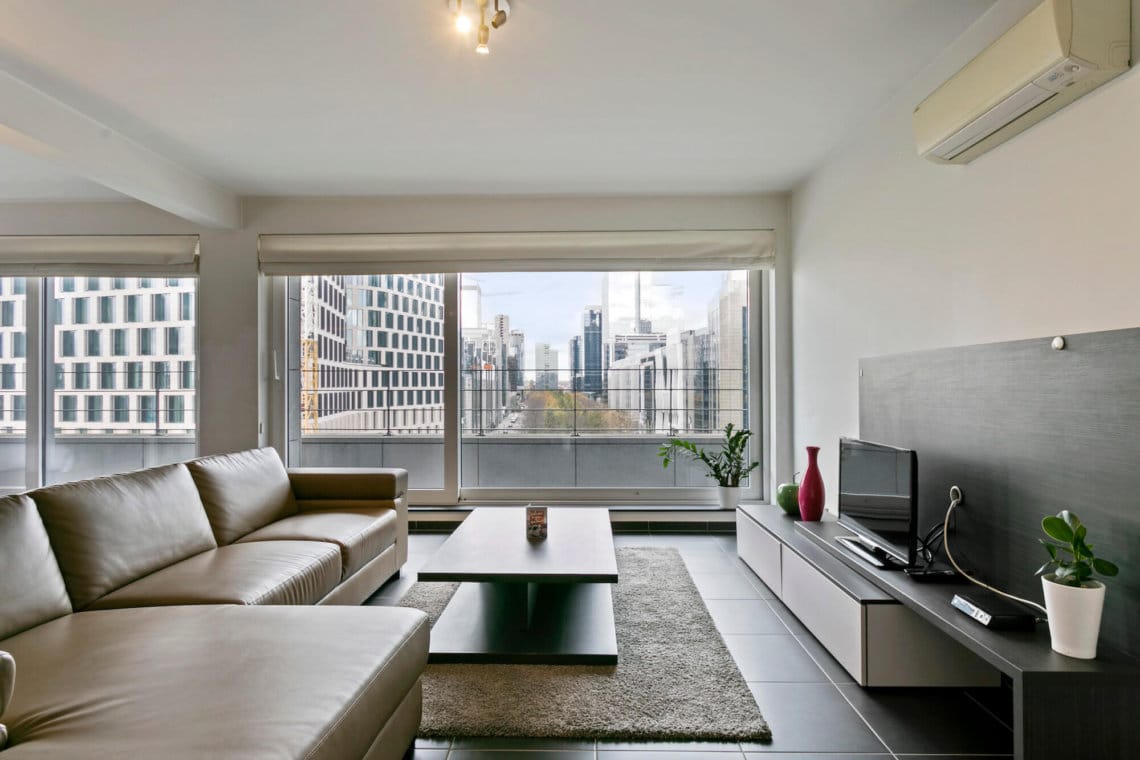 manhattan view two bedroom apartment living space with view down esplanade