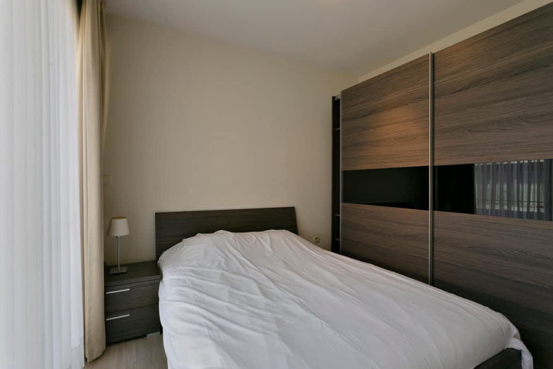 riverside one bedroom apartment master bedroom with large wardrobe