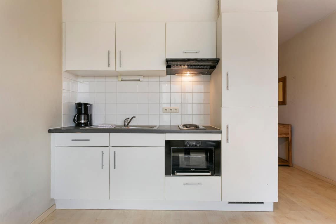 serviced apartment with fully equipped kitchen coffee machine and microwave oven