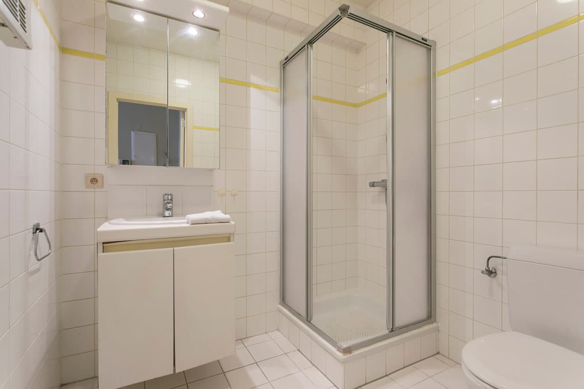 bathroom with shower in serviced apartment with cleaning provided