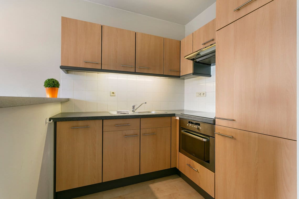 fully equipped kitchen with dishwasher in two bedroom serviced apartment