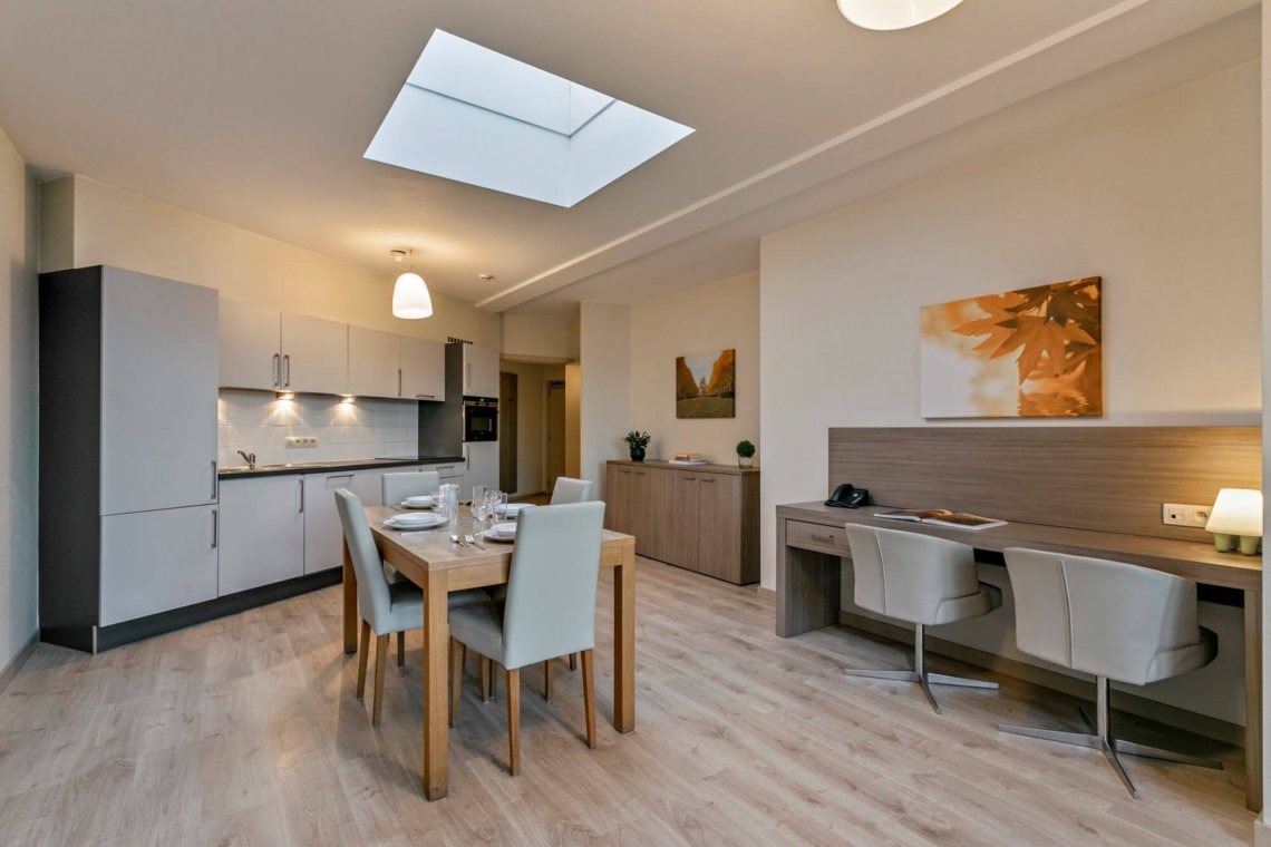 living room and dining table in two bedroom apartment in brussels