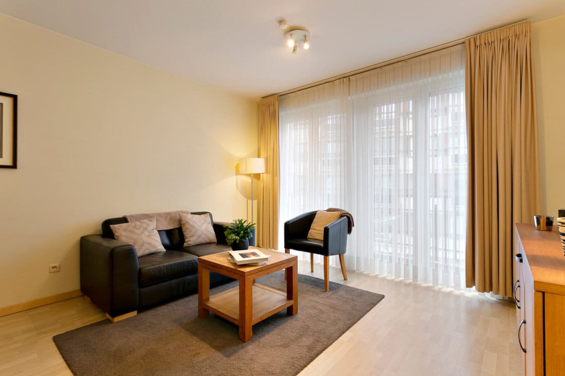 living room with sofa and cable television near place jourdan in etterbeek