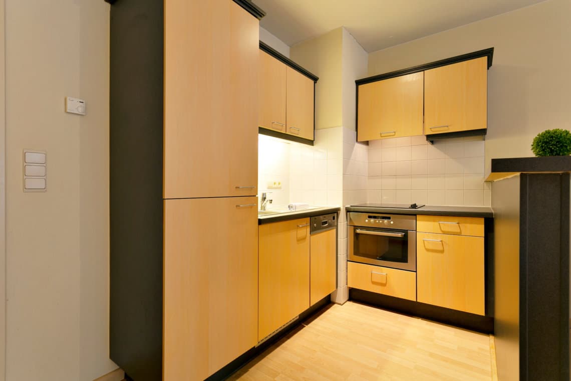 fully equipped kitchen with utensils and extra storage space in etterbeek near european commission