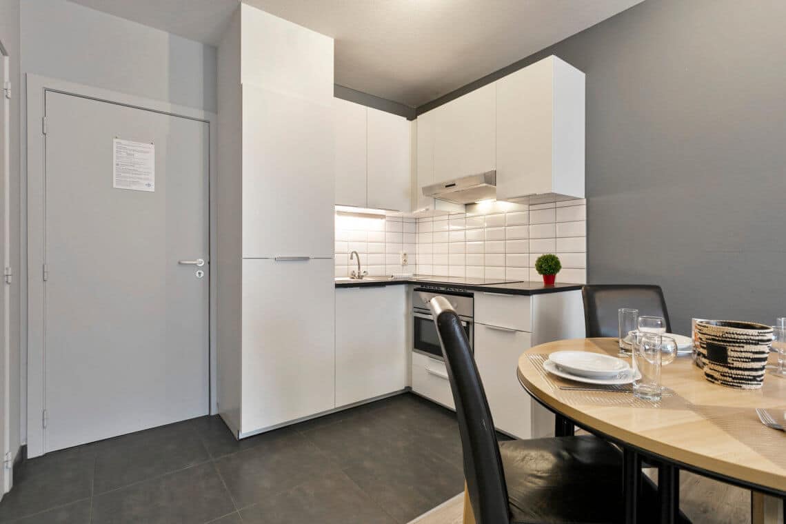 fully equipped kitchen in serviced apartment near european commission