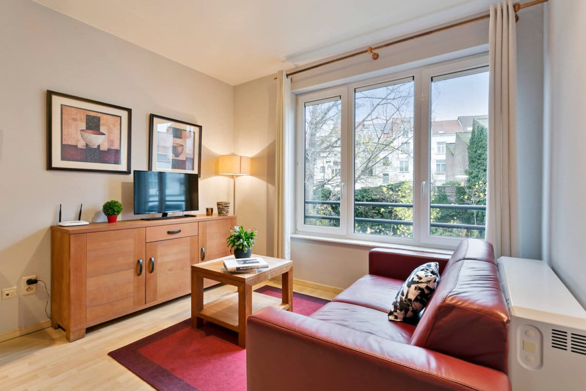 bright living room with cable television walking distance to the european commission