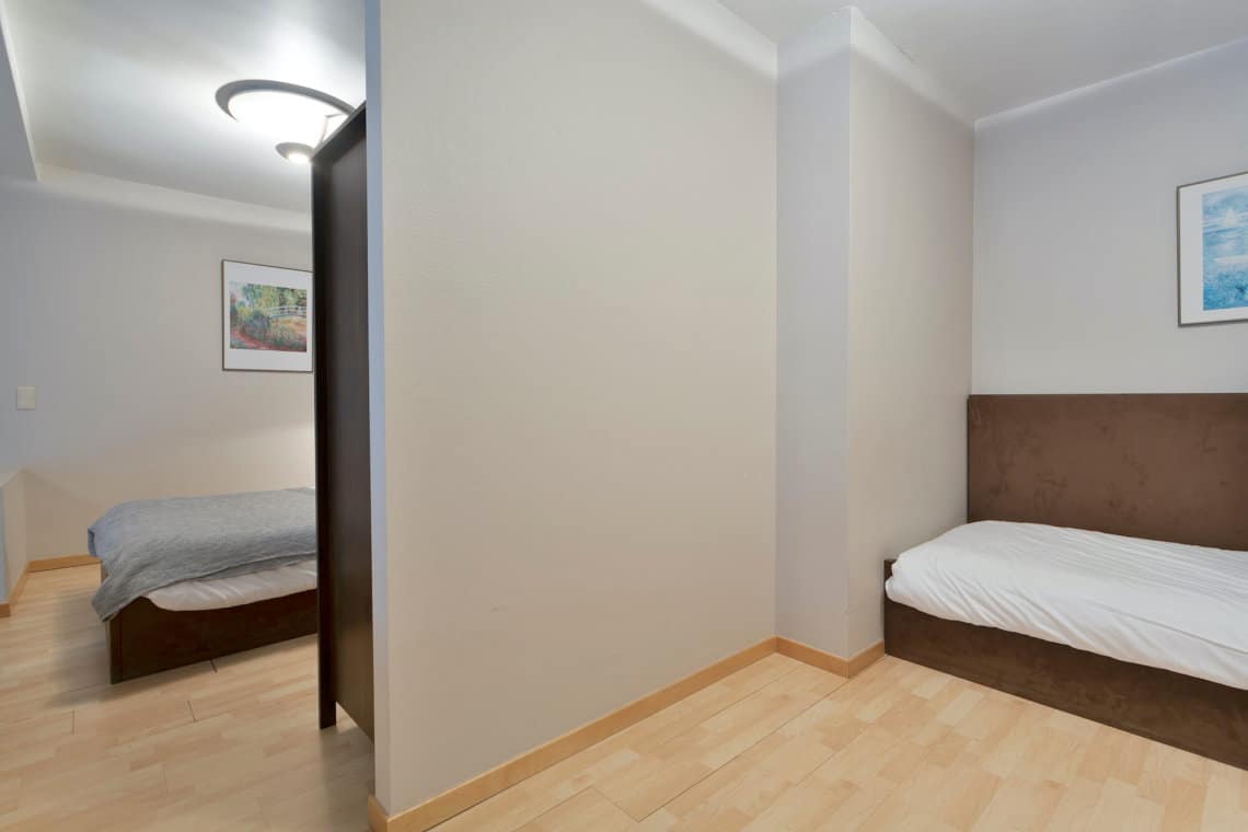 second bedroom with single bed in bbf serviced apartment