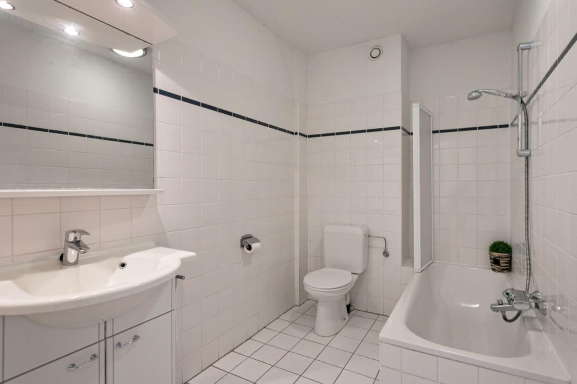 bathroom in serviced apartment with bath and shower