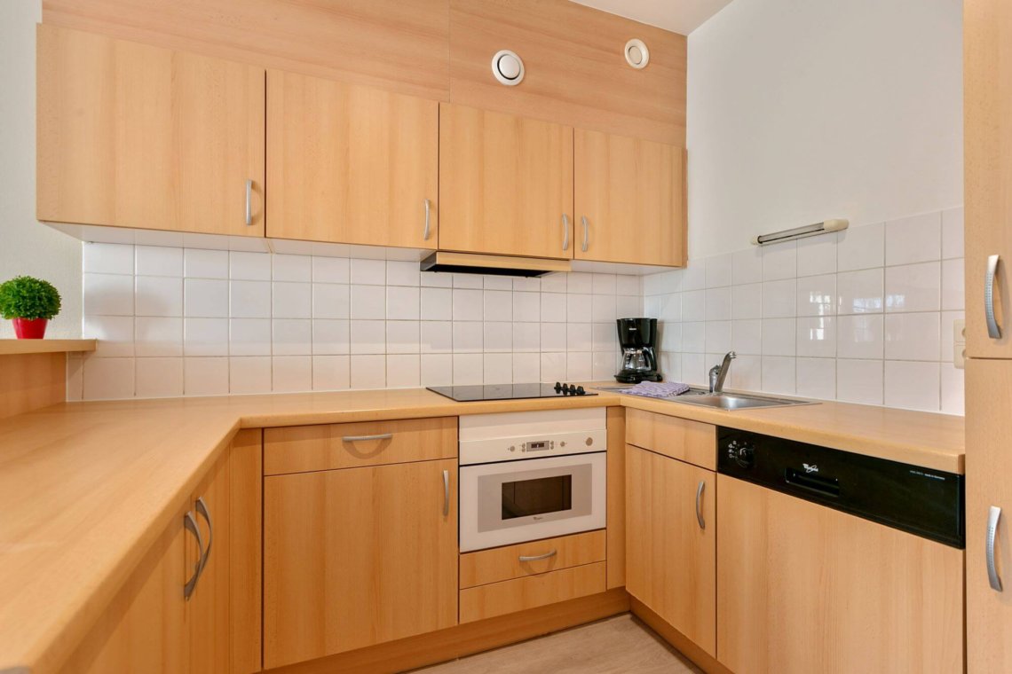 fully equipped kitchen with dishwasher in louise two bedroom apartment