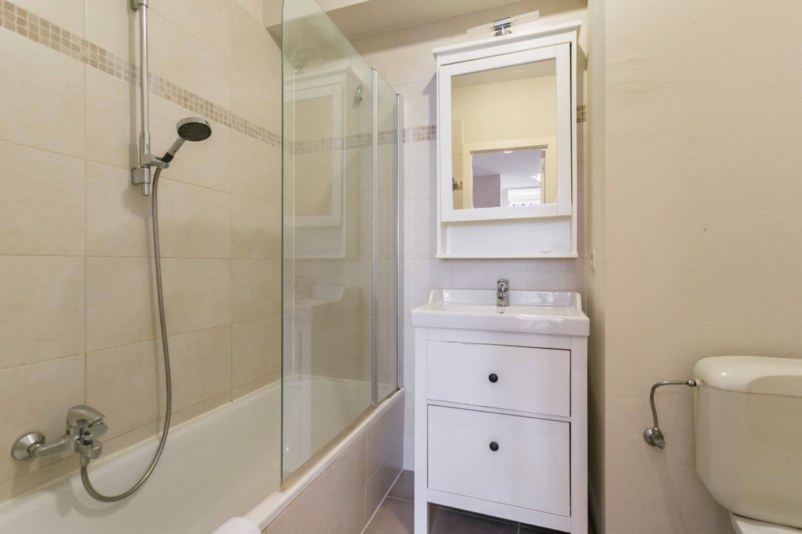 ensuite bathroom with shower and bathtub