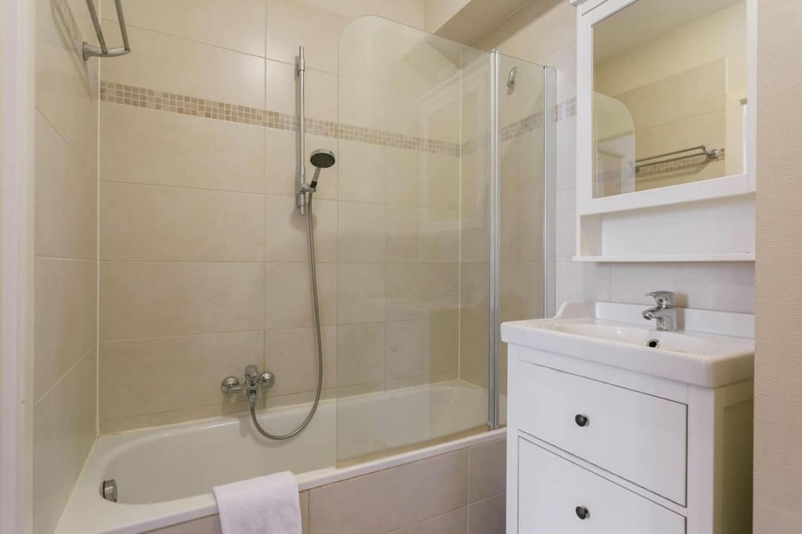 ensuite bathroom with shower and bathtub