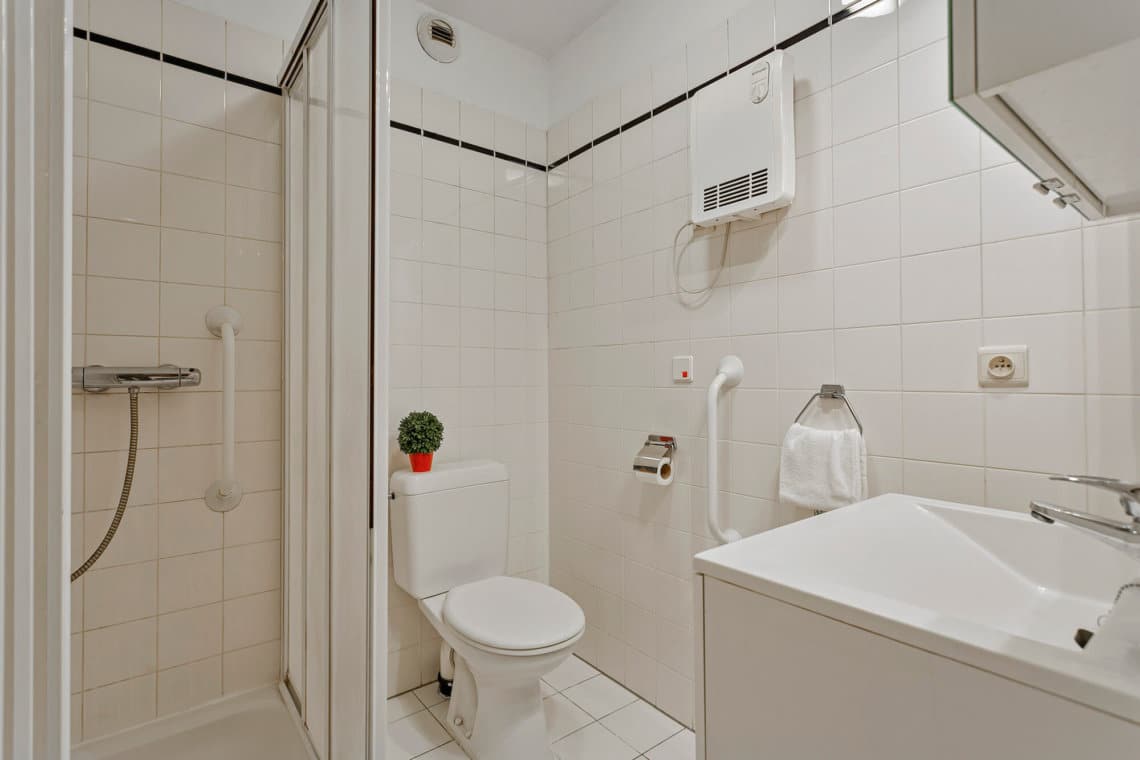 bathroom with shower and toilet and bi-weekly cleaning