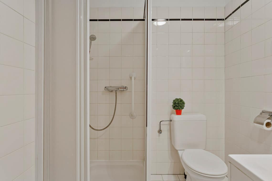 bathroom with shower and toilet and bi-weekly cleaning