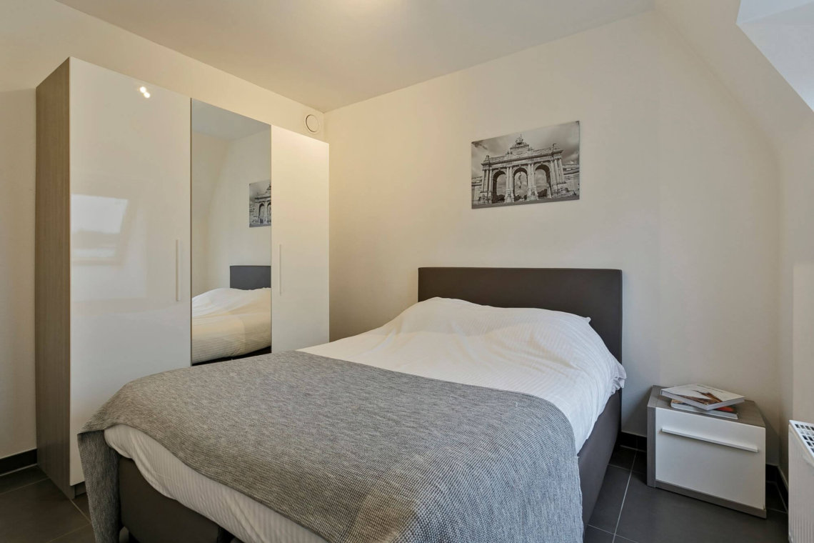 master bedroom in bbf serviced apartment with storage wardrobes west brussels