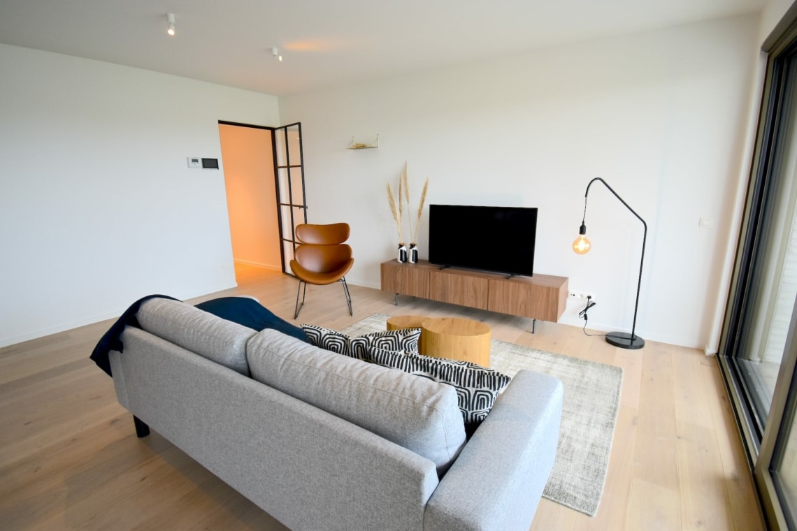 Spacious living room with a lot of natural light in Ghent